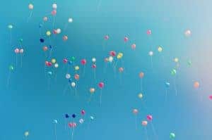 Balloons flying away in the sky 
