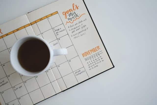 Calendar for goals this month with coffee